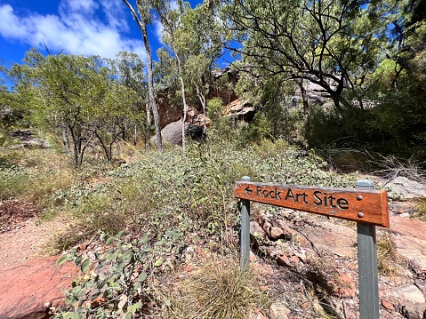 Cape York, Qld - June 21 2023:Road sign to the Indigenous Australian rock art paintings on Split Rock Laura in Cape York peninsula Queensland, Australia.Rock art is an integral part of First Nations life and customs.