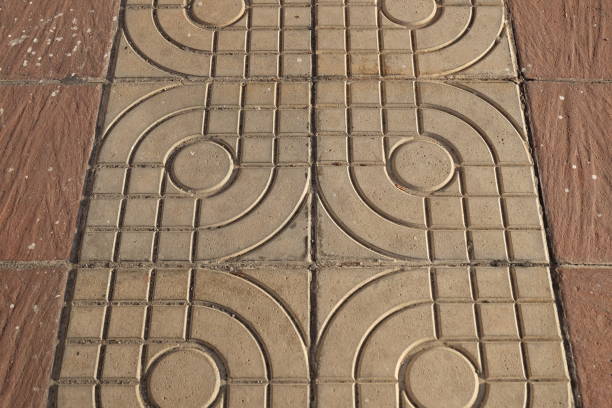 istock Detail of a patterned paving slabs in the park. 1564374731