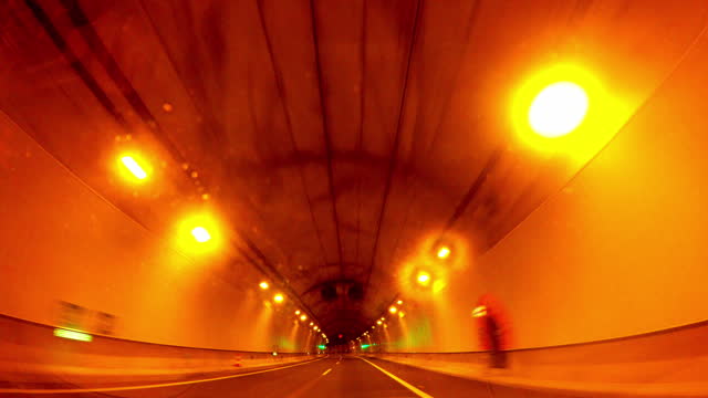 Driving in a road tunnel. Time Lapse. Bucle. Retro. Vintage. Loop