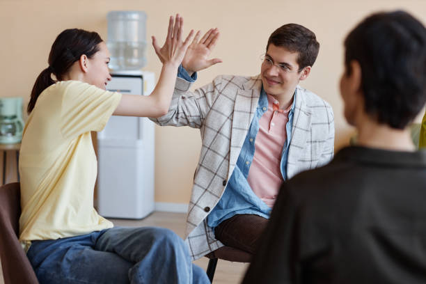 istock Young people greeting each other at session 1564404749