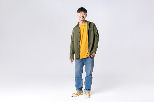 Full length young Asian man happy smile in formal shirt on isolated studio white background. Asian man happy smile in studio shot.