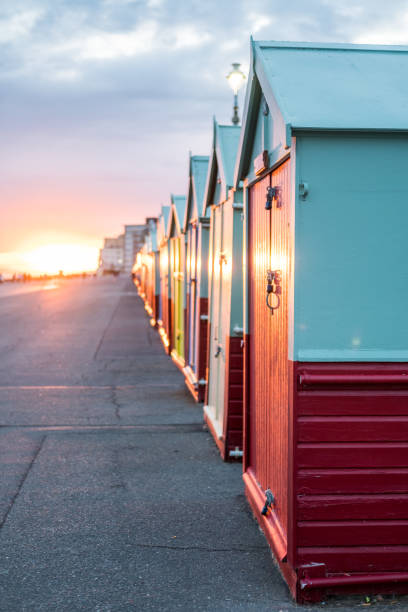 Colorful Beach Huts during sunset at Brighton and Hove, England Colorful Beach Huts during sunset at Brighton and Hove, England Hove stock pictures, royalty-free photos & images