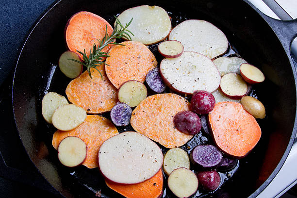 Fried Heirloom Potatoes and Yams in a cast iron skillet