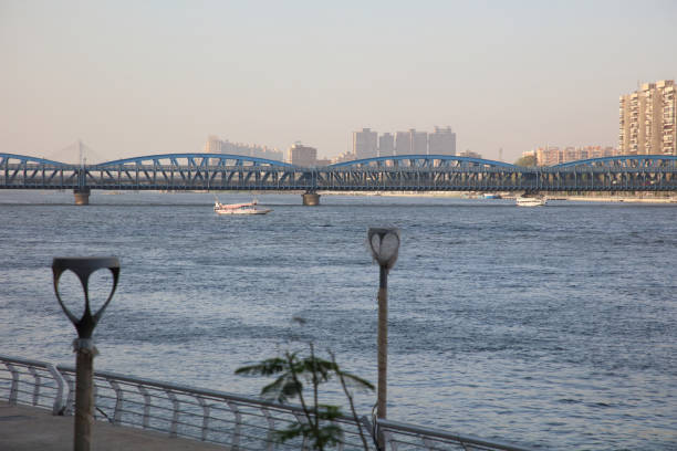 The green steel framework of Gdański Bridge stretches across the Vistula, supported by solid stone piers. A symbol of Warsaw’s resilience, it serves as a key link between past and present.