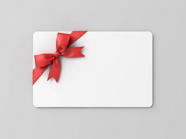 istock Blank white gift card with red ribbon bow isolated on grey background with shadow minimal conceptual 3D rendering 1564496304