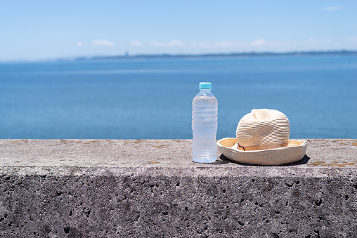straw hat and mineral water