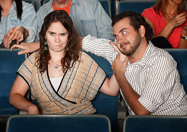 istock Annoyed Girlfriend In Theater 156454690