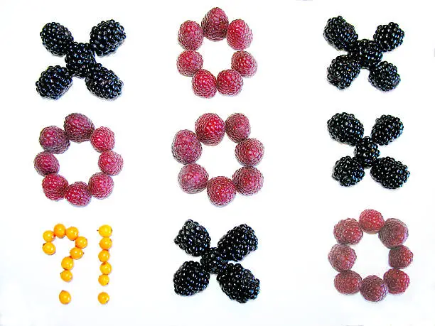 Noughts and crosses composed from berries