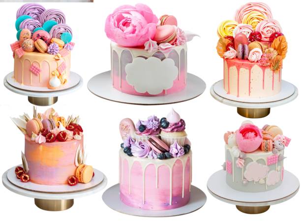 istock Various pink cakes isolated on white background. Cakes with raspberry, edible flowers, marshmallow, lollipops, chocolate, meringues and macarons 1564583522