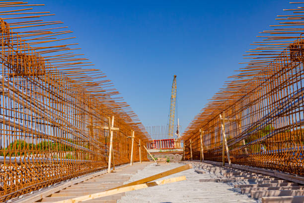 istock Steel rusted reinforcement bars placed for strength of bridge on the construction site. 1564593694
