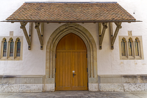 Old Schools University Offices on Trinity Lane.  In the foreground is the ancient oak wooden doors of Trinity College, Cambridge, Cambridgeshire, England, UK.