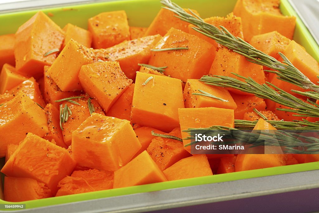 Slices of pumpkin in baking dish. Slices of pumpkin in baking dish closeup. Close-up Stock Photo