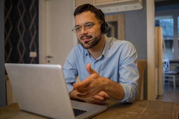 istock Young fashionable man working at home 1564606177