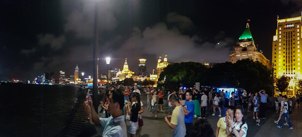 Shanghai, China - August 10th, 2016 - view of Shanghai City and Streets at night during our Walking (architecture features and chinese people)