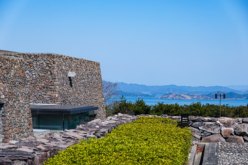 On a sunny day in March 2023, the Seto Inland Sea Museum of History and Folklore, selected as one of the top 100 public buildings, near the summit of Goshikidai, straddling Takamatsu City and Sakaide City in Kagawa Prefecture.