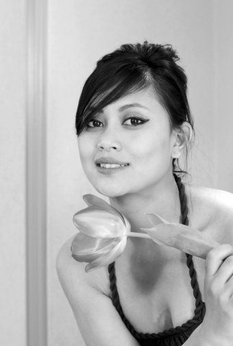 Beautiful female model with tulip flower