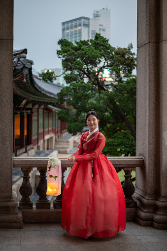 Pretty Korean girl wearing traditional Hanbok dress in Deoksugung palace in Seoul South Korea on 21 July 2023