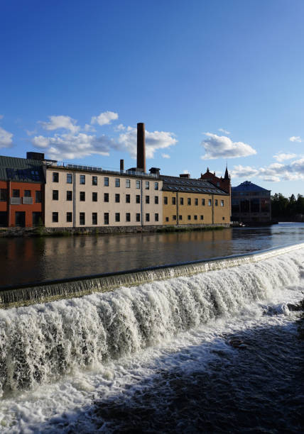 istock A waterfall next to industrial buildings 1564656208