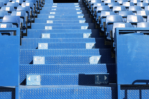 Seat rows numbers sign installed on stair grandstand.