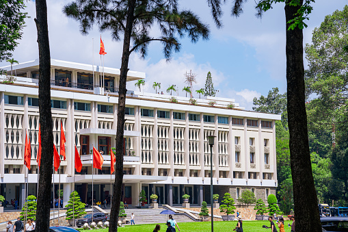 Ho Chi Minh, Viet Nam - 30 June 2023: Beautiful morning of front View Reunification Palace, which was a work of president and government to recognize national historic sites in Ho Chi Minh City, Vietnam