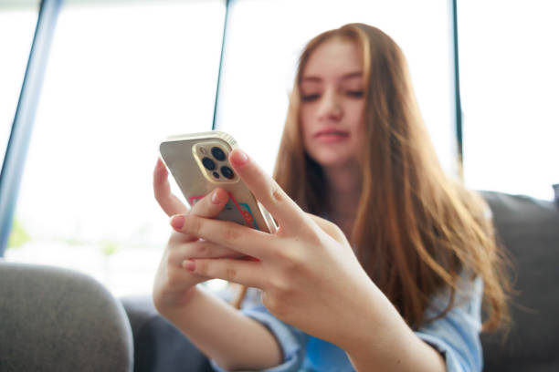 istock Smart phone. Young caucasian female student use martphone 1564672295