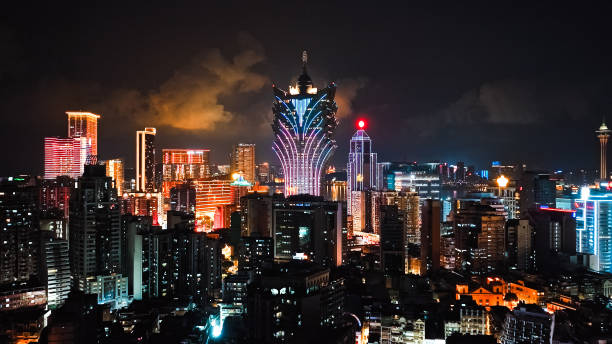 cityscape view of grand lisboa casino skyscraper building at macau island, financial business or entertainment district. drone aerial night view. asia travel landmark concept - 澳門 圖片 個照片及圖片檔