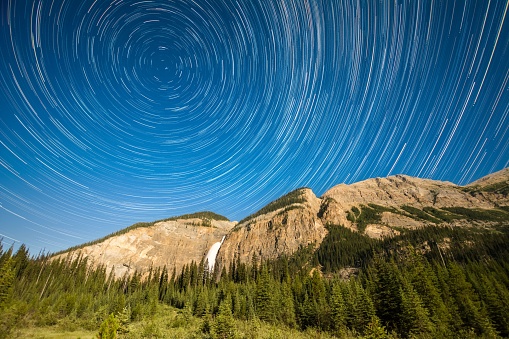 Beautiful star trails illuminate the night sky in Yoho National Park in the Canadian Rockies, British Columbia, Canada