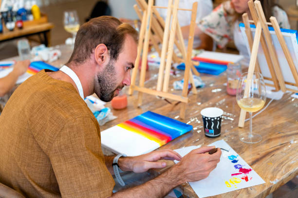 istock Wine & Canvas: Happy Friends Painting with Passion 1564687529