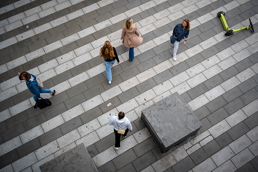 Stockholm, Sweden – June 18, 2022: A high angle shot of people walking around on the streets of Stockholm, Sweden