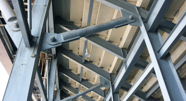 istock Grandstand steel structure hinges and fixed pin connection joint detail. 1564697228