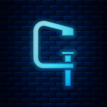 Glowing neon Clamp and screw tool icon isolated on brick wall background. Locksmith tool. Vector.