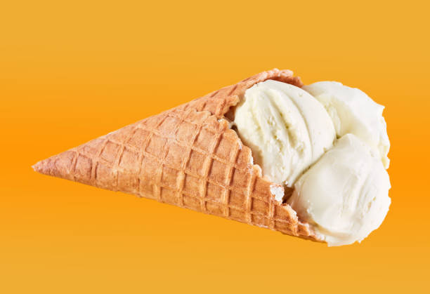 istock ice cream balls in a Waffle Cone on a Blue Background. Vanilla ice cream in a waffle cone. 1564713988