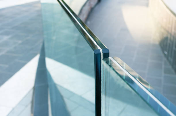 istock Closeup frameless laminated glass railing for exterior installation. 1564715716