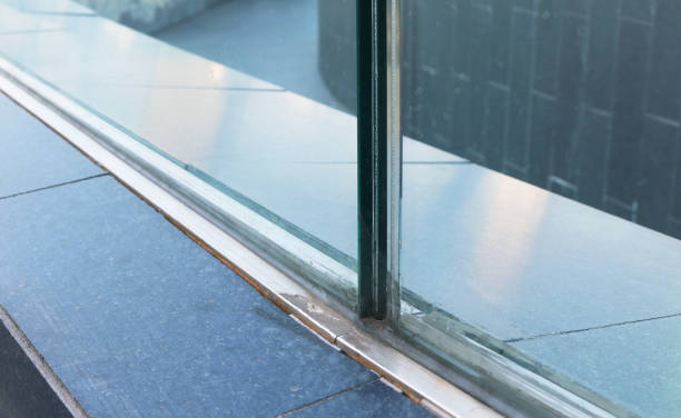istock Closeup frameless laminated glass railing installed on the floor. 1564716237