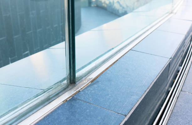 istock Frameless laminated glass railing installed on the floor detail. 1564716239