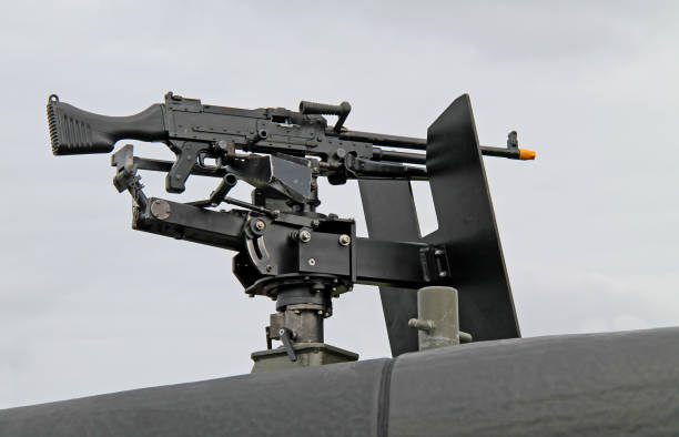 Machine Gun. A Machine Gun Mounted on the Top of a Military Vehicle. tripod attack stock pictures, royalty-free photos & images