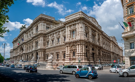 Rome, Italy – August 06, 2016: The Roman Palace of Justice Supreme Court of Cassation with cars driving by