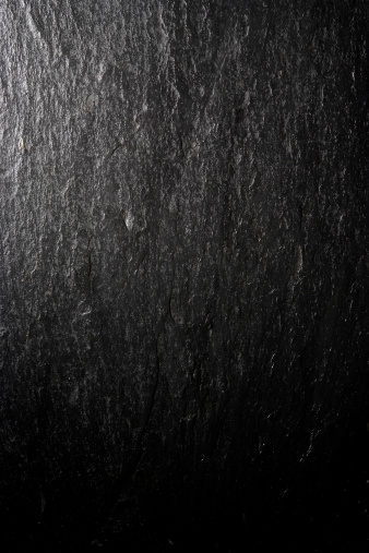 Close-up of shiny blank slate texture background. 