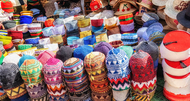 istock Typical colorful knitted and woven Moroccan hats on display for sale 1564758081
