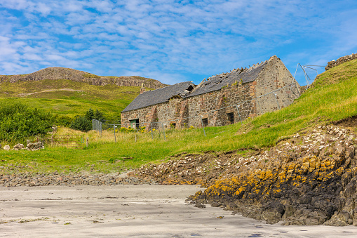 Coroghan Barn, Isle of Canna, Scotland. A Community Project on the Isle of Canna to repurpose and retain a delapidated barn into a barn which meets modern day needs.  Horizontal.  Copy Space