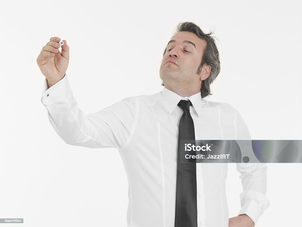 Empresário atraente com marcador preto em mãos, escrevendo - Foto de stock de Adulto royalty-free
