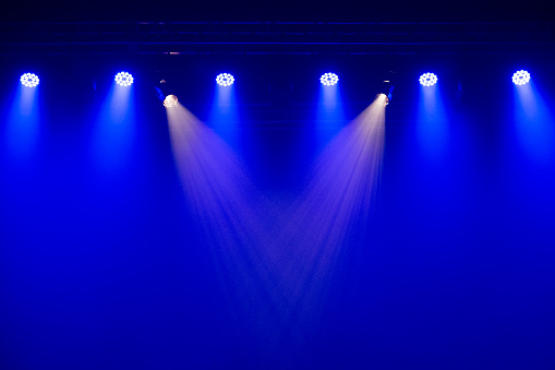Catalao, Goias, Brazil – July 07, 2023: Set of stage lights in a theater. Lighting equipment with lights in blue and white colors.