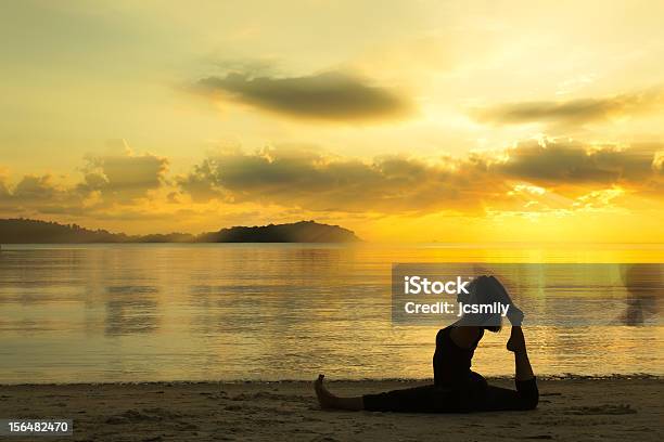 Silhouette Beautiful Yoga Girl At Sunrise On The Beach Stock Photo - Download Image Now