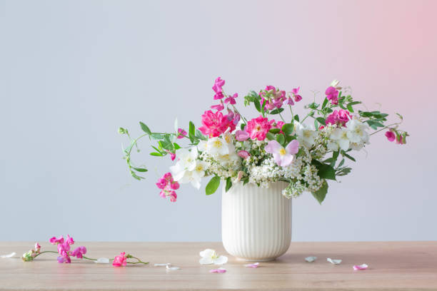 istock summer flowers in ceramic cup on light background 1564847620