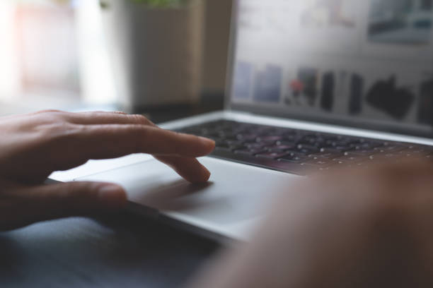 istock Woman using laptop computeror for browsing through online retail shopping site at home, online shopping, e-business, digital marketing concept 1564849017