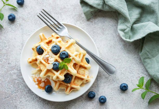 istock Freshly baked waffles with fresh  blueberries 1564850100