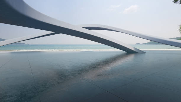 istock Abstract architecture design of modern building. Empty parking area concrete floor with beach and blue sky sea view. 1564856101