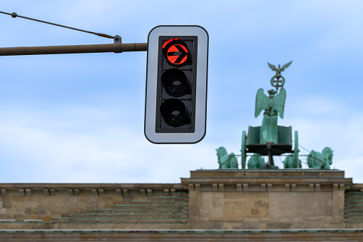 Low angle view of traffic light against Quadriga Statue at Brandenburg Gate