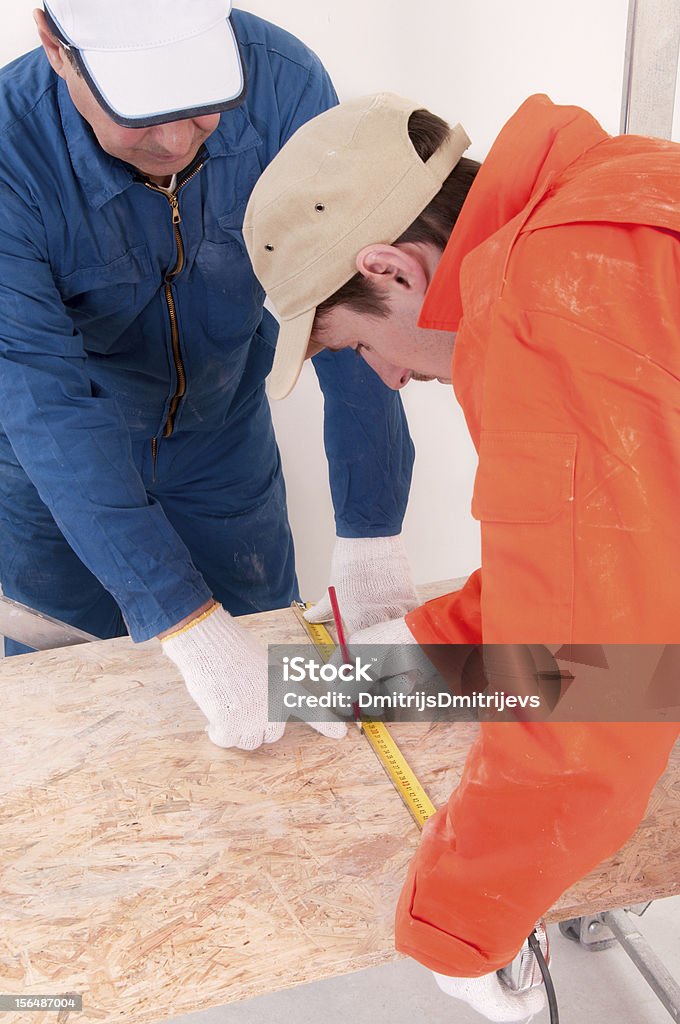 Trabalhador da Construção Civil fazendo a medição - Royalty-free Adulto Foto de stock