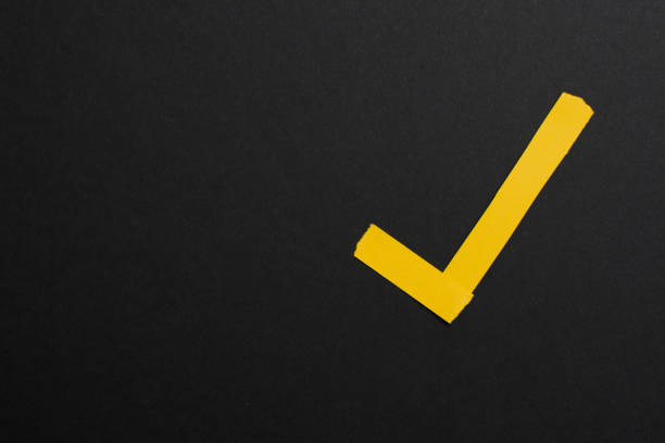 istock Simple yellow check, approval mark, symbol on black background 1564890310